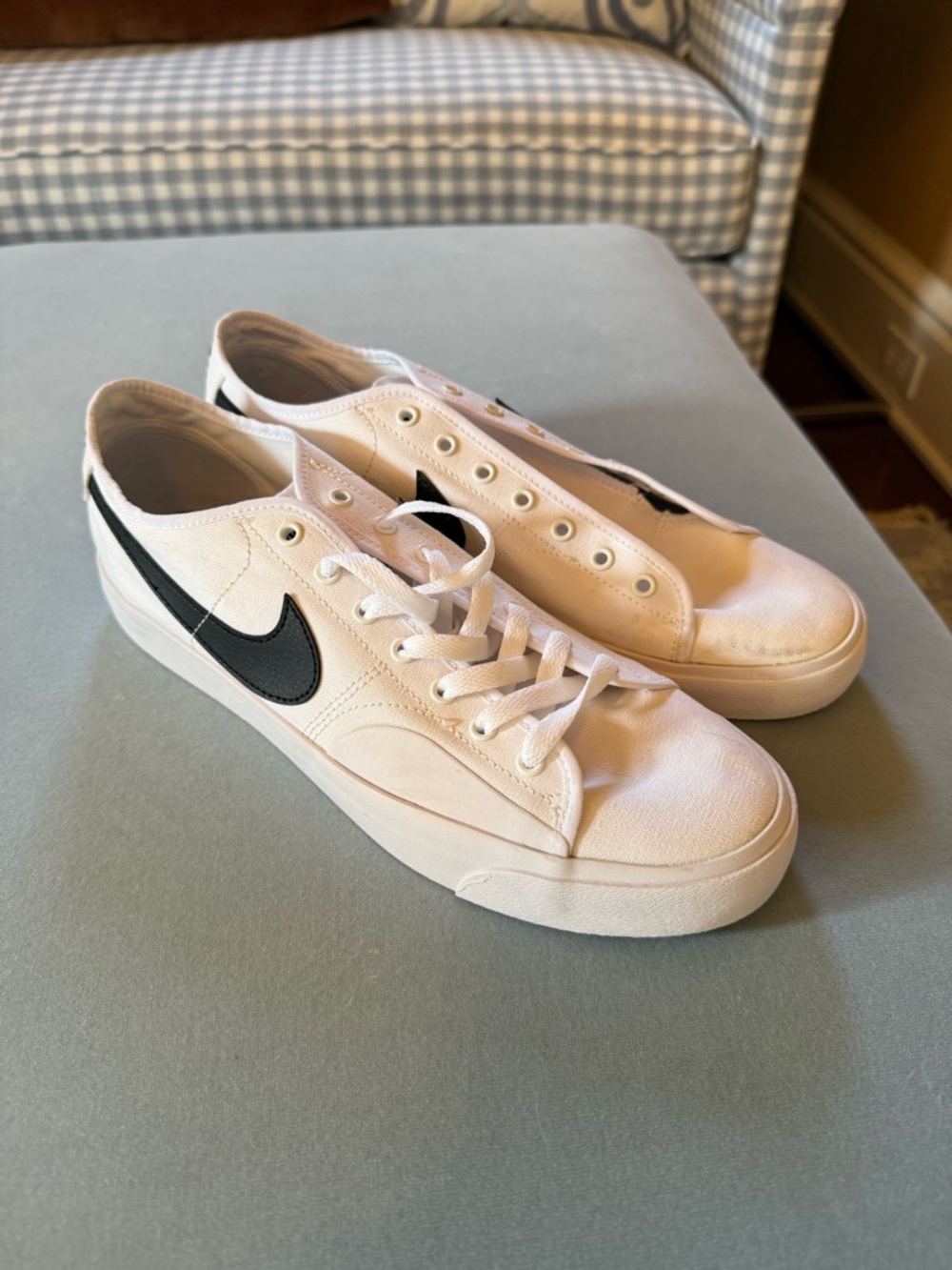 Men’s Nike White Canvas Low-Top Sneakers with Black Swoosh Accent